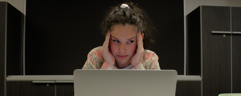girl frustrated in front of computer